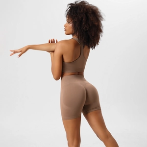 Seamless rib-knit yoga set with high-waist shorts and sports bra in earth-tone tan