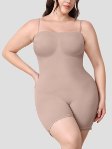 Detailed macro view of the seamless ribbed fabric texture on the beige body shaper