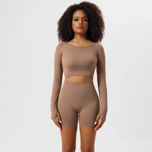 Detail of seamless dark khaki yoga set with long sleeve crop top and ribbed waist shorts