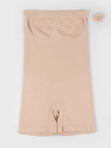 Close-up of seamless nude shapewear bodysuit with adjustable straps and tummy control fabric
