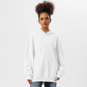 Detailed close-up of a white oversized hoodie with a front kangaroo pocket and drawstrings