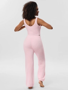 Close-up of pink plush loungewear fabric texture on women's three-piece pajama set