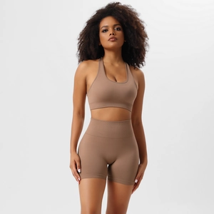 Detail of mocha brown seamless yoga set showing racerback sports bra and high waist shorts