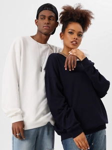 Detail view of oversized heavy cotton sweatshirts in white and navy blue colors