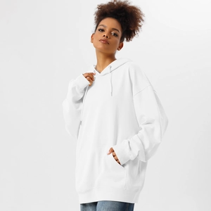 Detail of oversized white hoodie with kangaroo pocket and adjustable drawstring hood