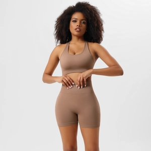 Detail of ribbed hem and seamless knit texture on a high-waisted brown yoga set