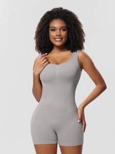 Detail view of seamless grey shaping bodysuit with wide straps and mid-thigh length cut