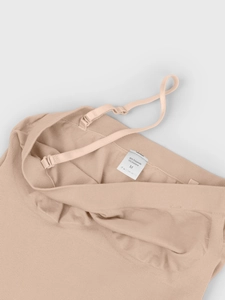 Detail of nude seamless shapewear showing 85% Polyamide fabric and adjustable straps