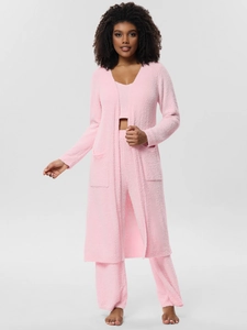 Close-up of pink three-piece fleece pajama set featuring soft knit texture and fluffy cardigan