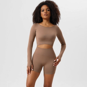 Detailed close-up of seamless mocha yoga set featuring thumb holes and ribbed texture