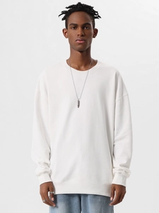 Close-up of white heavy cotton crewneck sweatshirt with drop shoulder and relaxed fit details