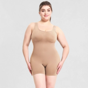 Detail of high-stretch seamless beige shapewear bodysuit with wide neckline and short legs
