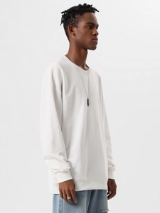 Detail shot of heavyweight cotton crewneck sweatshirt with ribbed cuffs and loose fit