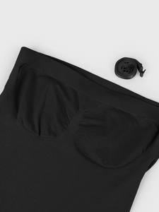 Detail of seamless bodysuit showing built-in pads and removable adjustable straps