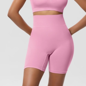 Close-up of pink high-waisted seamless fitness shorts with ribbed texture and elastic band