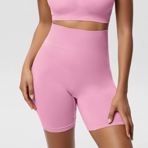 Detailed texture of pink high-waist seamless compression shorts with ribbed knit fabric