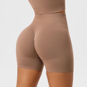 Macro shot of brown high-waisted seamless yoga shorts showing scrunch butt and ribbed texture