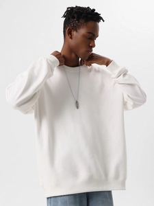 Detail of premium heavy cotton white crewneck sweatshirt with silver bullet necklace accessory