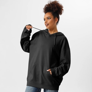 Close-up of oversized black hoodie with kangaroo pocket and drawstring on white background