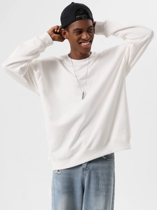 Detailed view of heavy cotton white crewneck sweatshirt with ribbed cuffs and hem style
