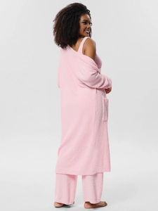 Detailed texture of pink plush three-piece loungewear set with soft cardigan and pants