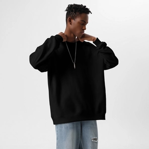 Detail of heavyweight cotton sweatshirt featuring ribbed cuffs and relaxed drop shoulder