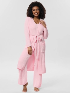 Detailed texture of pink plush three-piece pajama set with belted robe and wide-leg pants