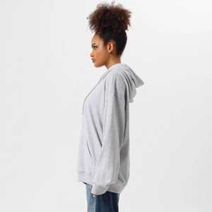 Side view of oversized grey hoodie showing relaxed drop-shoulder fit and kangaroo pocket