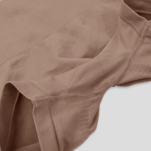Detail of coffee brown seamless yoga pants showing high-elasticity ribbed knit texture