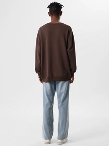 Rear view of heavy 350g cotton loose-fit brown sweatshirt with ribbed hem and dropped shoulders