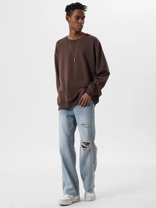 Detail of dark brown heavy cotton sweatshirt with relaxed drop shoulder and crew neck design
