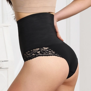Macro detail of high-waist slimming thong with floral lace and firm control fabric