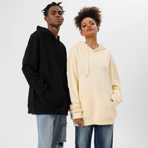 Detail of oversized hooded sweatshirt featuring premium cotton blend and kangaroo pocket