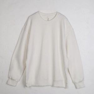 Detailed macro view of the crew neck collar and beige brand label on white cotton sweatshirt