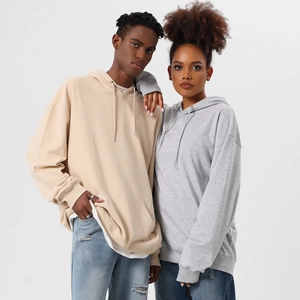 Detail of oversized hoodies showing soft cotton fabric texture and kangaroo pocket detail