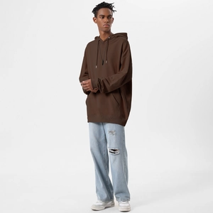 Detail of oversized dark brown hoodie with adjustable drawstring and kangaroo pocket