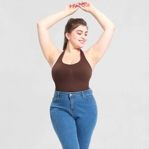 Detail of dark brown halter bodysuit paired with classic blue high-waist slim denim jeans