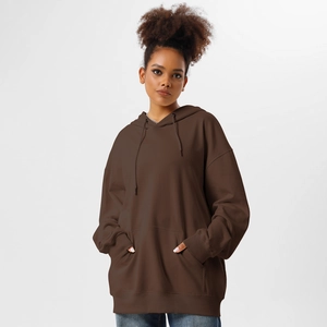 Close-up of deep brown oversized hoodie featuring a drawstring hood and kangaroo pocket