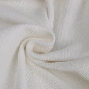 Macro shot of 350g heavy cotton fabric texture and thickness on a white sweatshirt