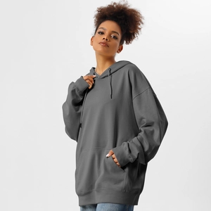 Detail of oversized dark grey hoodie with drawstring hood and kangaroo pocket