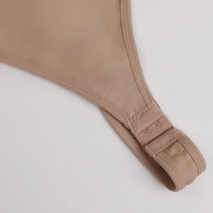 Detailed close-up of a seamless shapewear bodysuit featuring double-row metal back closures