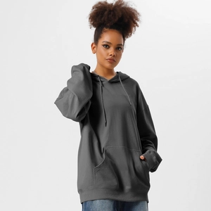 Detail of dark grey oversized hoodie featuring ribbed cuffs and front kangaroo pocket