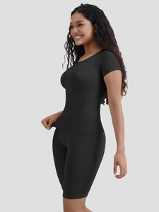 Side view of black ribbed knit short sleeve top and high-waisted shaping shorts set