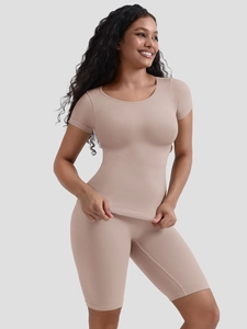 Close-up of beige seamless short sleeve top and high-waisted shaper shorts in ribbed fabric
