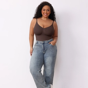 Detail of dark brown V-neck shaping bodysuit paired with light blue vintage jeans