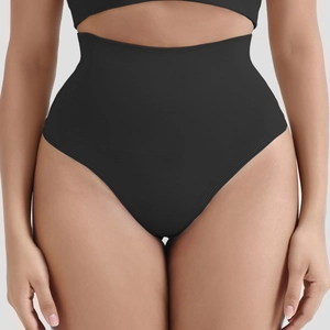 Macro detail of seamless high-waisted shaping thong in black ribbed elastic fabric