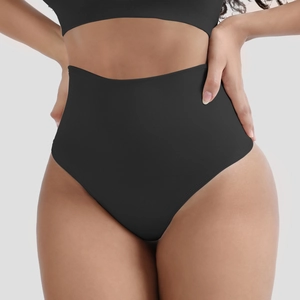 Detailed view of black seamless high-waisted shaping thong with rib textured compression
