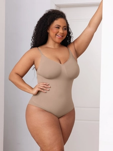 Detail showing seamless compression bodysuit in beige with slim straps and V-neckline