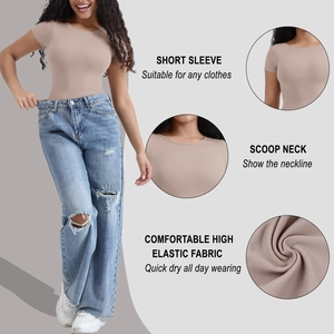 Slim fit nude bodysuit with scoop neck and short sleeves paired with blue jeans