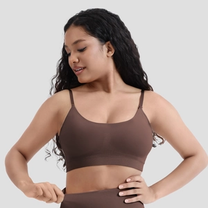 Front view of brown seamless sports bra with removable pads and ribbed bottom band